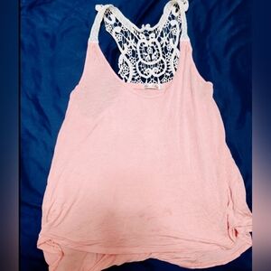 Pink tank top with design.